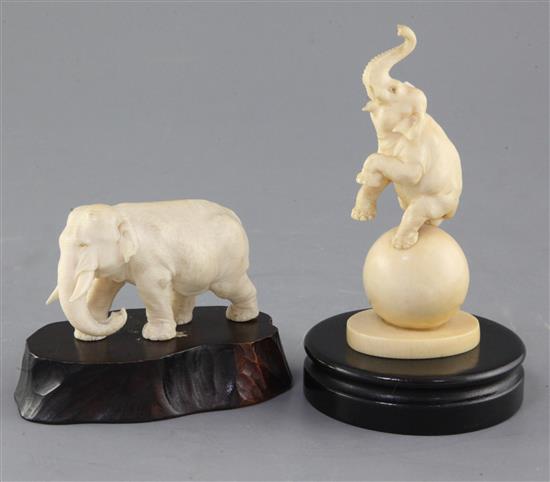 Two Japanese ivory figures of elephants, Meiji period, 13cm, two wood stands